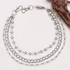 Double-sided studded bullet trouser chain