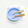 Ciotola in silicone azzurro cielo con manico in legno, cucchiaio, f