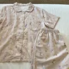 Pantaloncini a maniche corte con fiocco rosa kt