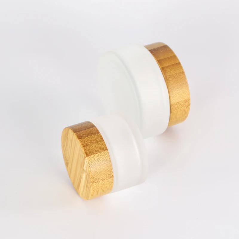 Hot selling natural 100g 50g 30g 15g 5g engravable frosted glass cosmetic facial cream jar with bamboo lid