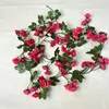 A vine with 69 small magenta roses (1.8m)