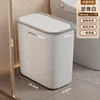 Medium-sized white bathroom trash can with flip-top lid