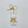 White with key ring tassel