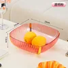 Square, luxurious fruit platter in translucent pink.