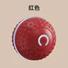 Luminous bouncy ball with raised dots (red), 7.5cm in diameter.