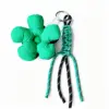Cordon bicolore vert et noir, motif floral vert et noir.