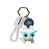Porte-clés ailé 8 cm avec pendentif et yeux lumineux