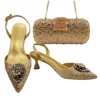 2 gold shoes and bag