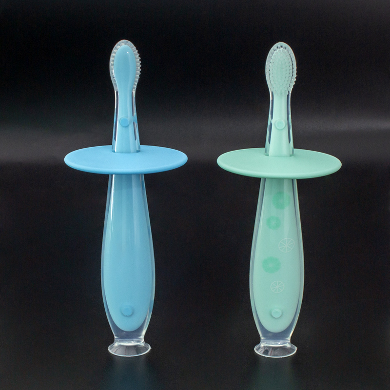 OEM цветной защитный блок, предотвращающий проглатывание, синяя ручка, стоячая всасывающая детская силиконовая зубная щетка