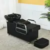 Black bed, black porcelain basin