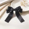 Black polka dot bow hair clip