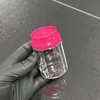 Botella transparente con tapa rosa
