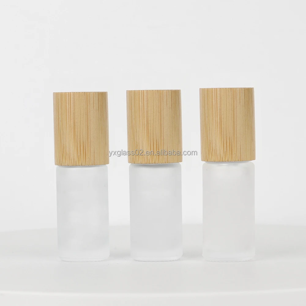 Roll On glass Bottle 5ml 10ml essential oil roller bottles skincare cosmetic packaging glass bottle with bamboo wooden cap supplier