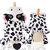 A four-legged flannel black and white cow transforms