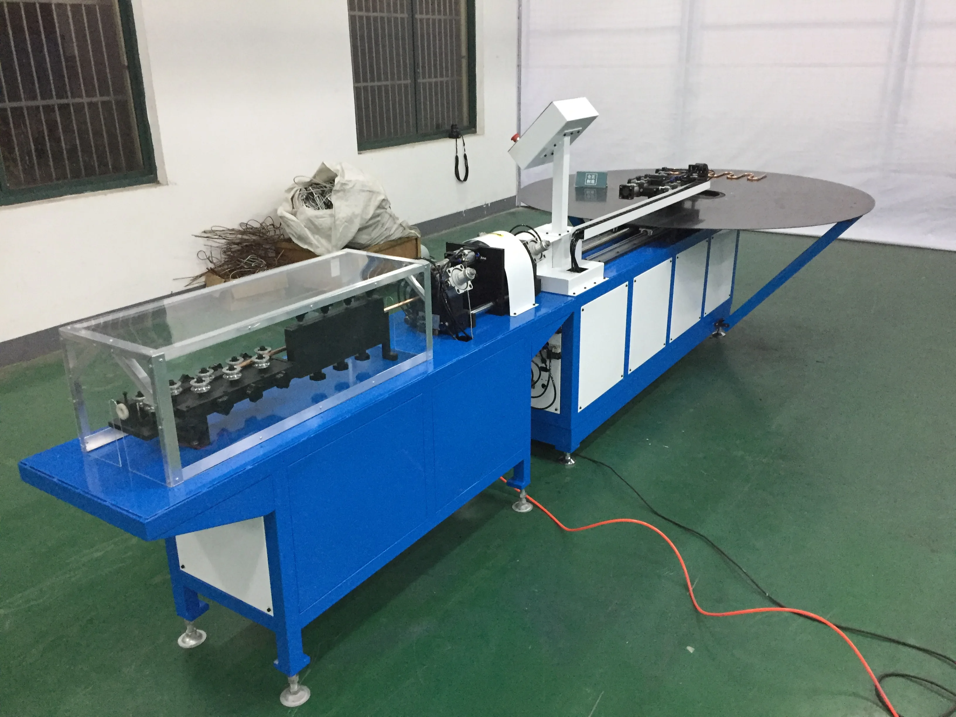 BOBO Machine automatic pipe tube straightening bending serpentine and cutting shown in a detail photo for this news article
