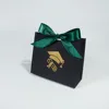 Black bag with green ribbon