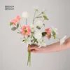 Pink amaryllis and white dandelion bulb bouquet