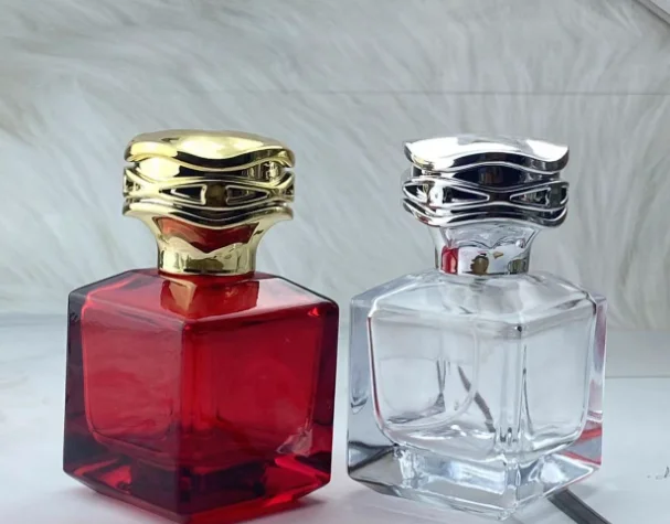 Hot Sale 50ML square Custom Color Red Transparent Perfume Glass Bottle with Flower-shaped Gold and Silver Lid