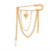 Gold Brooch with heart pendant