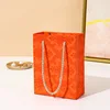 bolsa de papel naranja