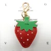 Red and green leaf lobster clasp