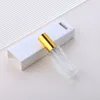 Clear glass spray bottle + gold cap + white box