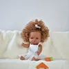 White ballet costume, brown skin, blonde hair