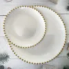 Gold beads on white background