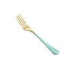 gold green dinner fork