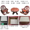 Two rocking chairs and a table in a box