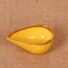 Assiette jaune style goutte d'eau