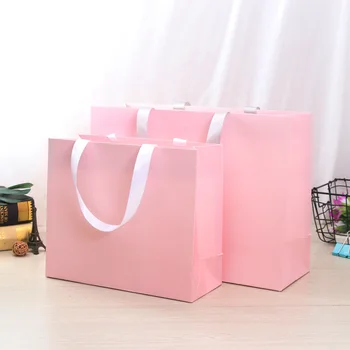 Custom Pink Paper Shopping Bags with Ribbon - Rope Handles & Bowtie Decoration - Multiple Sizes for Gift & Retail Packaging
