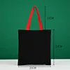 Bolso tote rojo de 21*23 con asa de lona negra.