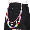Cadena para pantalón con colgante de cruz acrílica.