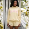 Yellow, pink letters with white edge