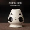 Adorable cat-shaped tea whisk stand.