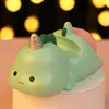 Soporte para teléfono con trasero de dinosaurio