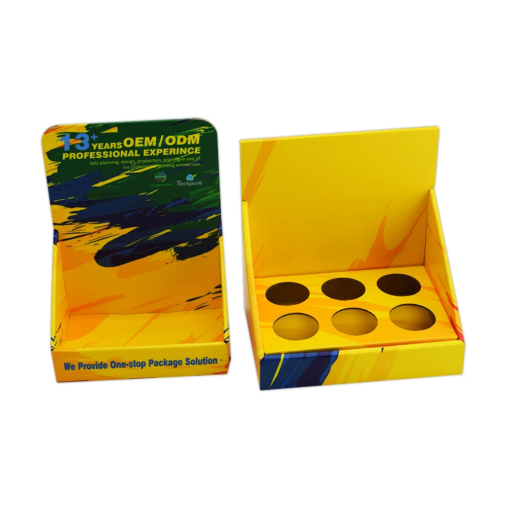 Corrugated Cardboard Retail Display Box with Matt Lamination and Embossing for Cosmetics Counter Stand with Holes