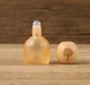 Tapa de madera en forma de bola naranja de 10 ml con logo del Árbol de la Vida