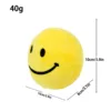 Sfera antistress a forma di tromba gialla con faccina sorridente - spugna interna