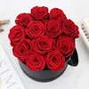 12 rose in scatola rotonda nera