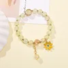 Bracciale con margherite e perline popcorn giallo chiaro