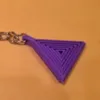 Juego de tres piezas de llavero triangular