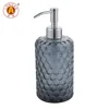 Grey glass bottle with matte lotion pump