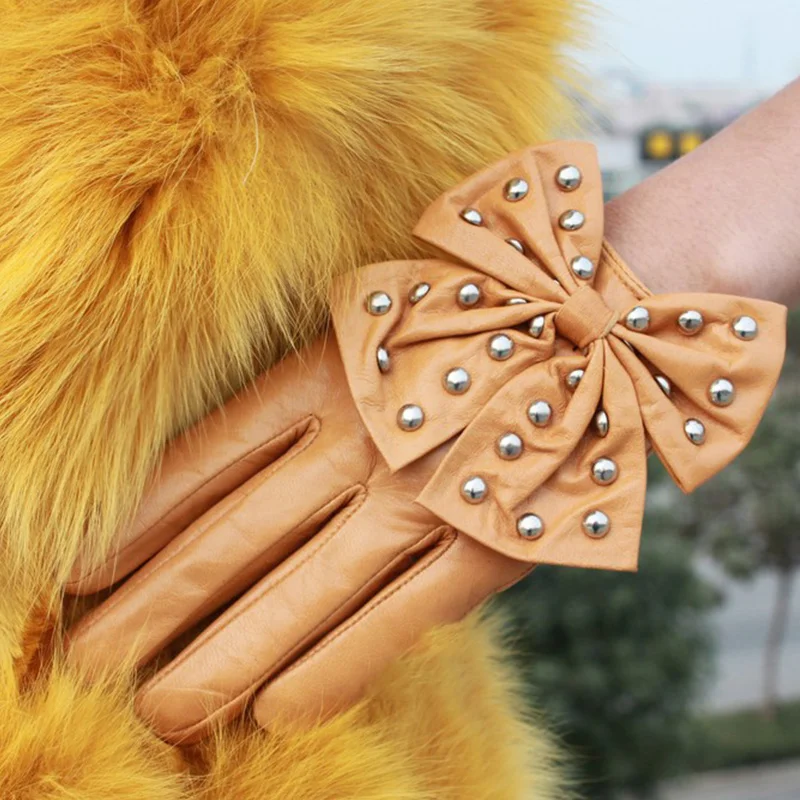 Orange leather bow gloves