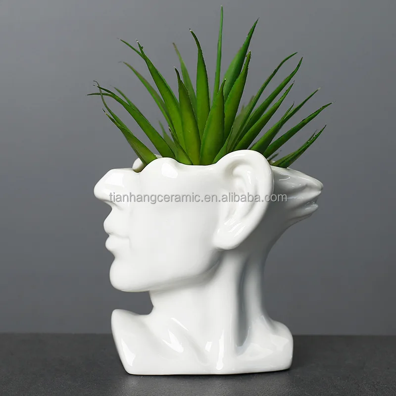 Modern Creative head ceramic black white face home decoration flower arrangement vase.jpg