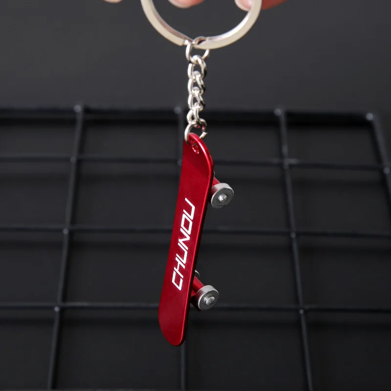 supreme skateboard keychain