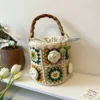 Borsa a secchiello con fiori di camelia serie verde