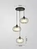 Lustre à disque noir à trois têtes