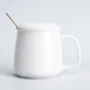 Glossy white warm cup with lid and spoon